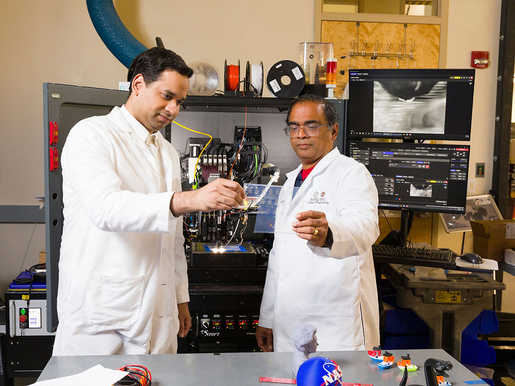 Professor Rama and Professor Ali in the lab