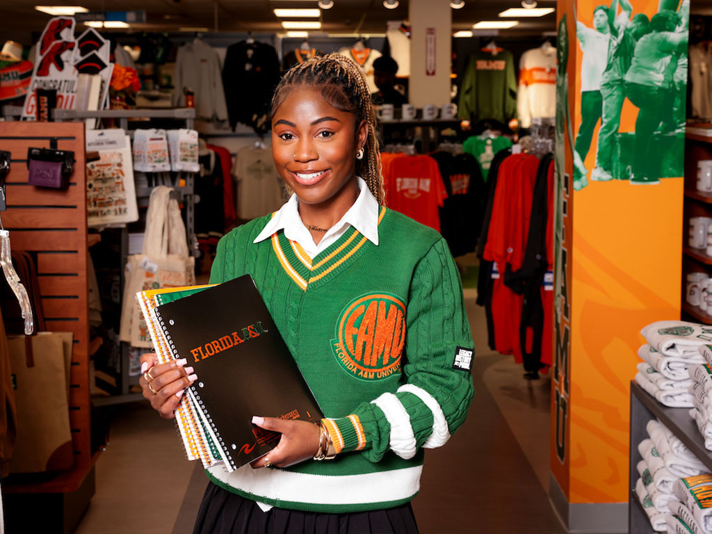 FAMU student dressed in Rattler gear in the bookstore.