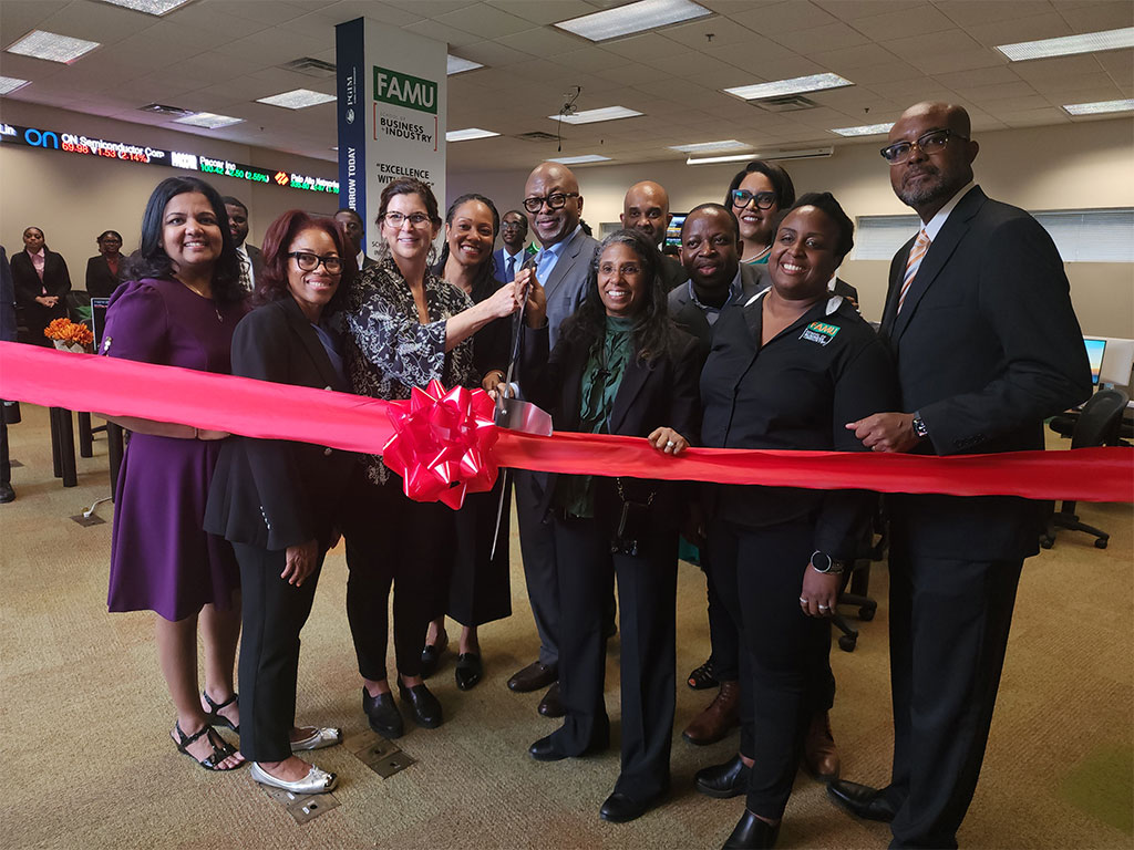 Faculty and staff from Florida A&M University’s School of Business and Industry (SBI) gather for a ribbon-cutting ceremony at the school’s Investments and Analytics Lab, which provides students with hands-on learning opportunities and access to Bloomberg technology used in the financial industry. Photo courtesy of FAMU School of Business and Industry.