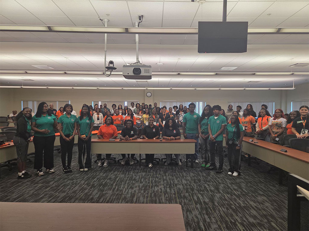 Students and SFEPD ambassadors pose following a campus financial education session designed to expand access to personal finance resources and strengthen financial decision-making skills among the FAMU community.