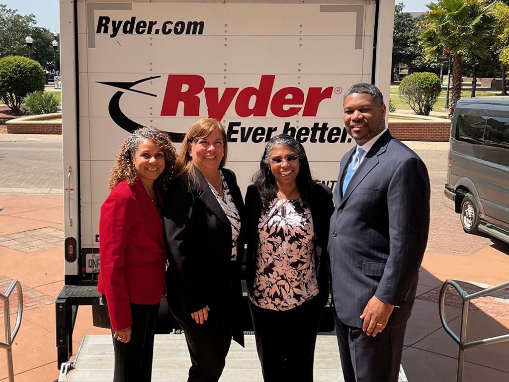 SBI faculty poses infront of Ryder truck