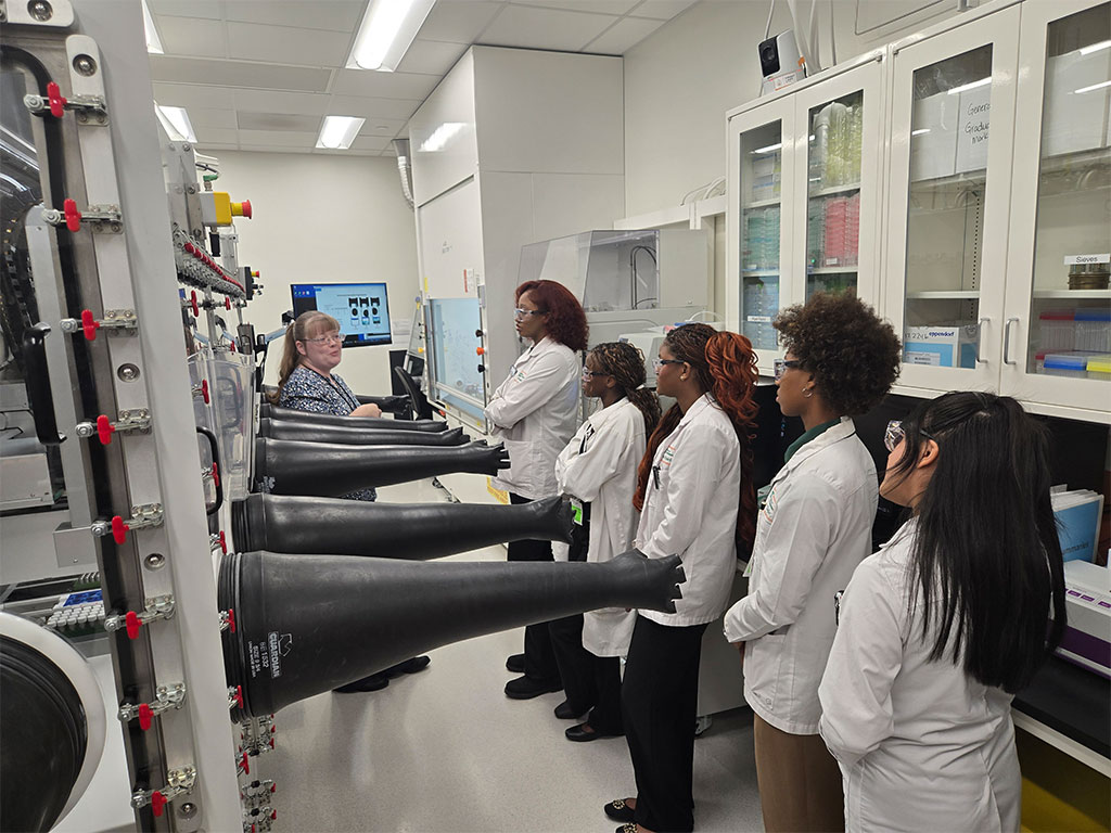 Florida A&M University School of the Environment students tour a research laboratory at Pacific Northwest National Laboratory (PNNL), where scientists discussed advanced analytical instrumentation and demonstrated technologies used to support environmental, energy and national security research. (Photo courtesy of Joel Blount.)