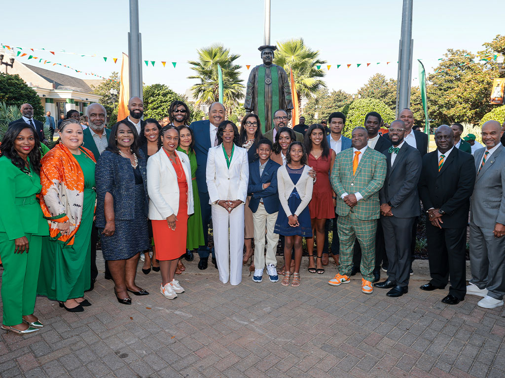 Community and family gather for a photo op of this major moment.