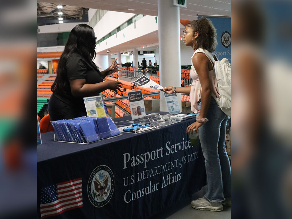 A Florida A&M University student speaks with a U.S. Department of State representative about passport services and resources during FAMU’s Study Abroad Fair.