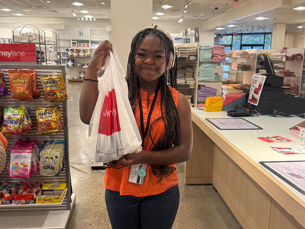 FAMU first-year biology pre-medical student Gabrielle Jefferson smiles while holding her JCPenney purchases during the Suit Up JCPenney event at Governor’s Square Mall in Tallahassee. The event provided students with access to discounted professional attire as they prepare for upcoming career opportunities. (Photo courtesy