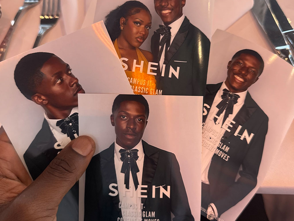 The image is of a picture of J'Corion Johnson in a nice black tux during his Shein brand ambassador trip
