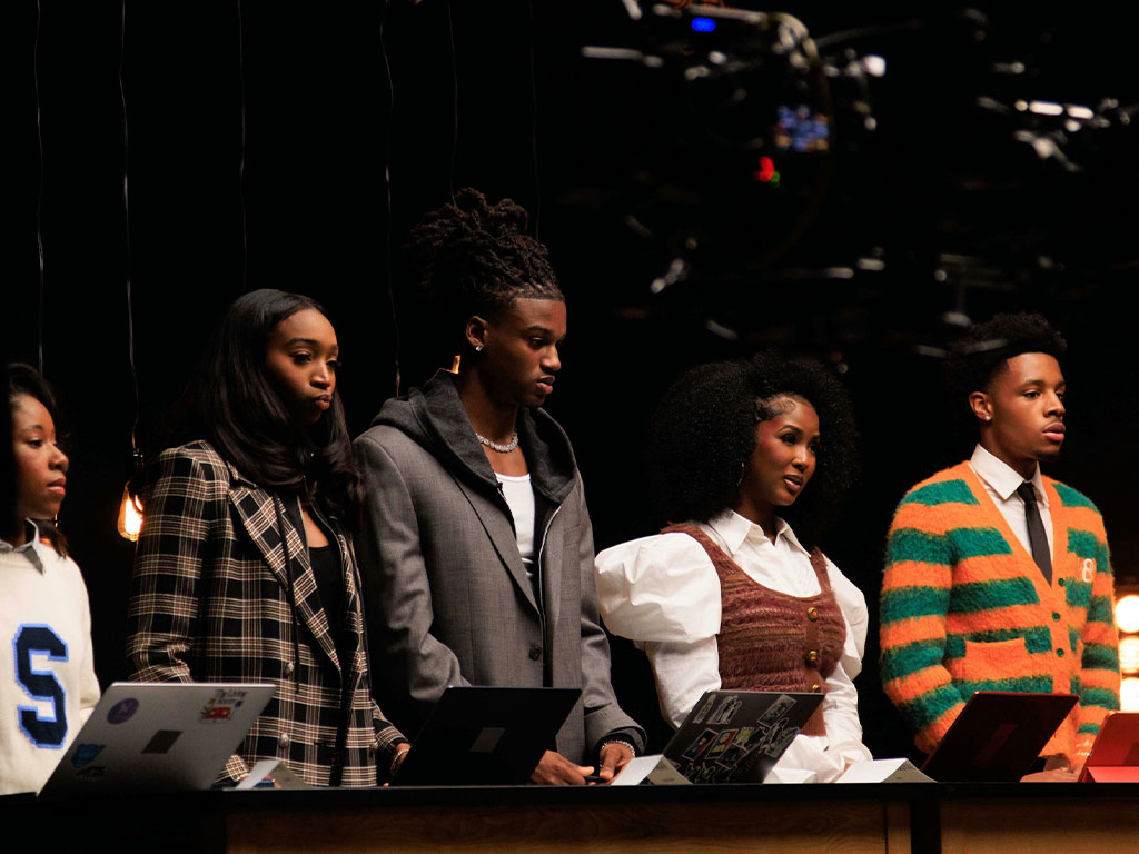 Khari Jackson, center, a Florida A&M University public relations scholar and founder of KTVDIDTHAT, participates in a business pitch challenge during the filming of REVOLT's "Bet on Black: Visions to Ventures"