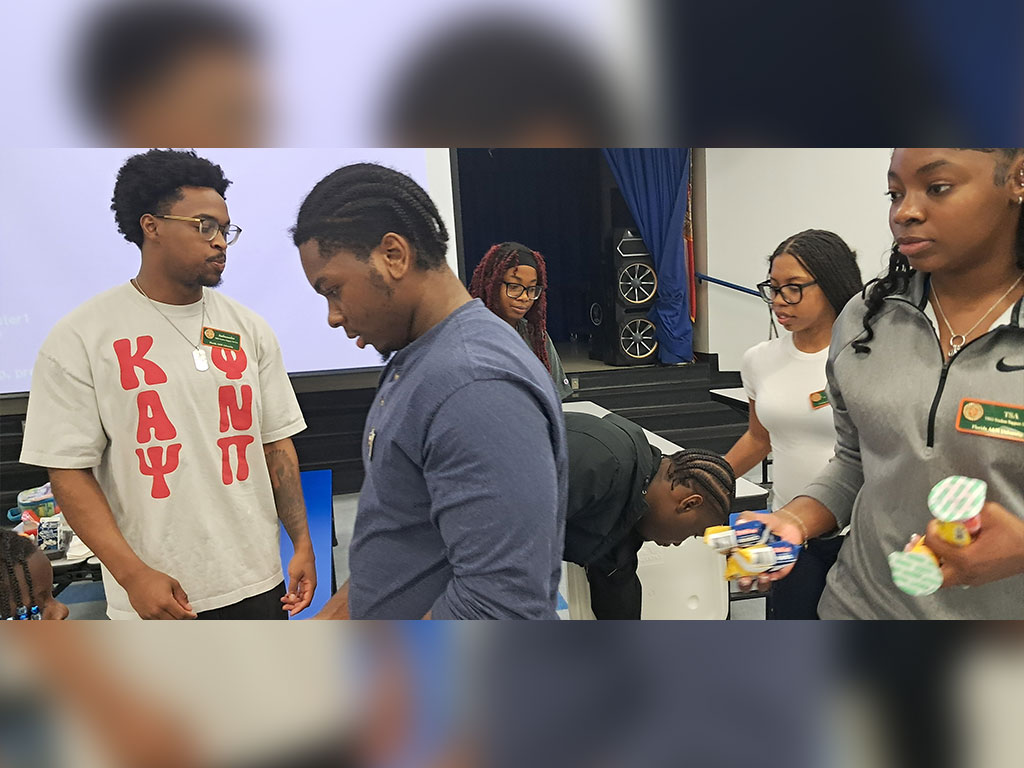 A Florida A&M University TRIO student ambassador smiles while representing the program during National TRIO Day activities, highlighting FAMU’s commitment to student success and STEM engagement.