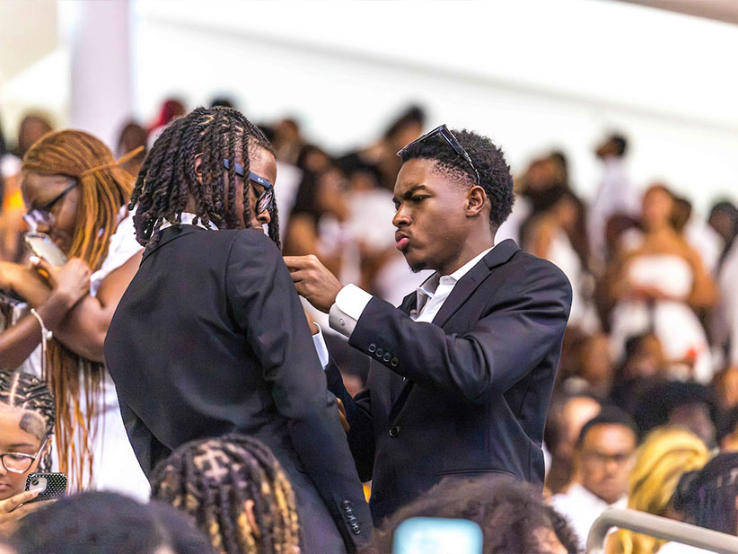 Two young men pinning each other
