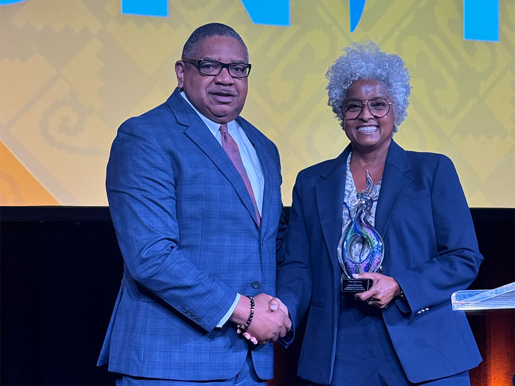 Florida A&M University’s School of Business and Industry, accepts the UNCF Faculty Torchbearer Award on behalf of SBI during the UNCF UNITE Conference. The award recognizes the collective impact of faculty in teaching, research, mentorship, innovation and student success. Photo courtesy of FAMU School of Business and Industry.