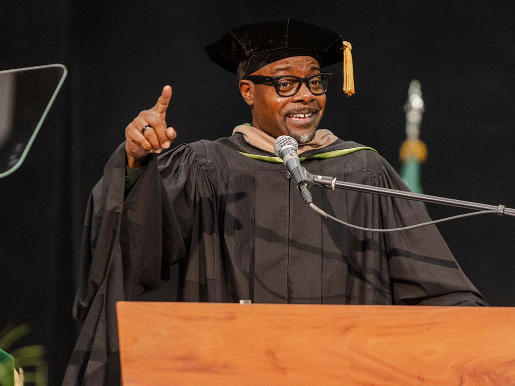 Commencement speaker and Florida A&M University alumnus Tirrell D. Whittley delivers the keynote address during the University's Summer 2026 Commencement Ceremony at the Alfred Lawson Multipurpose Center and Teaching Gymnasium. Whittley's speech, centered on the theme "Full Circle Moments," took on added significance as his youngest daughter, Taylor Whittley, graduated alongside the Class of 2026. (Photo courtesy of Michael Cork.)