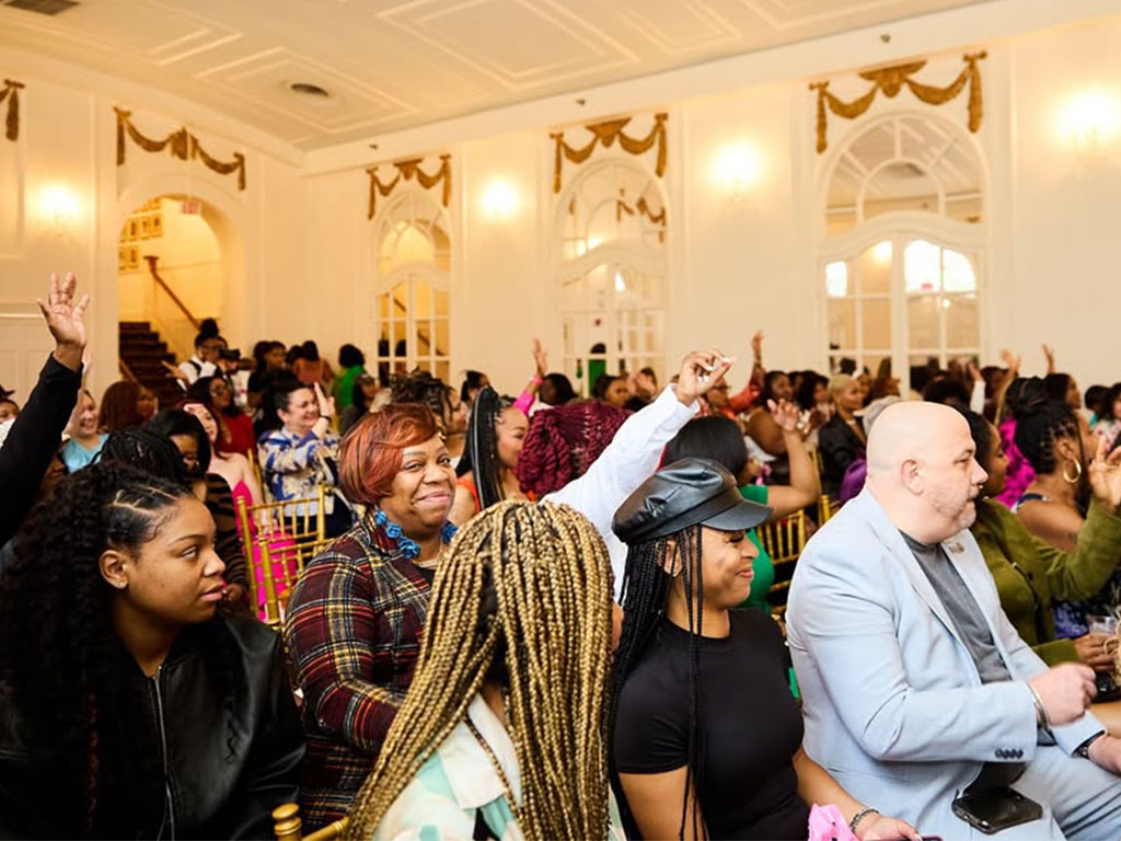 Attendees sitting enjoying the conference. 