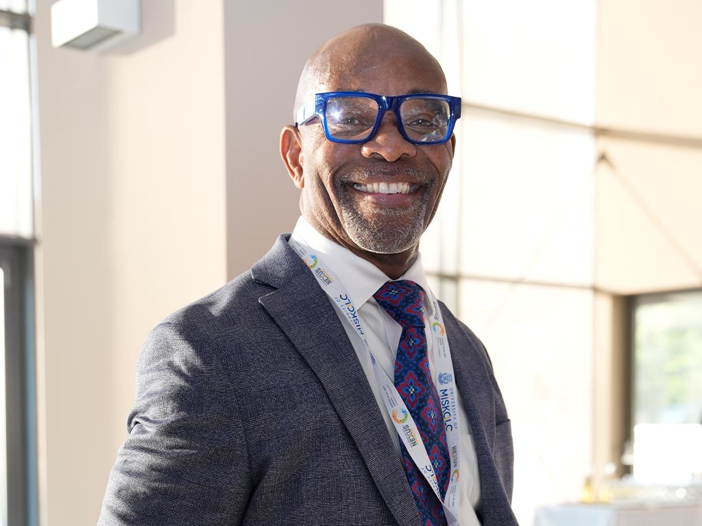Dean Victor Ibeanusi smiles through the summit 