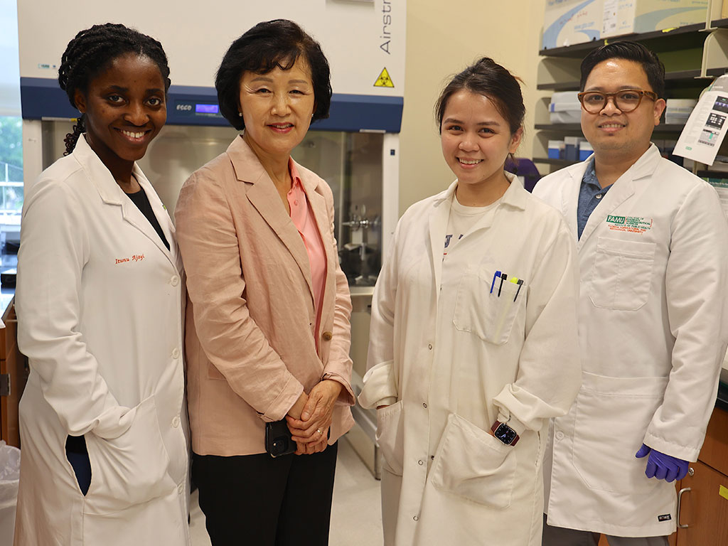 Principal Investigator Eun-sook Yu Lee, Ph.D. (second from left) poses with her research team: doctoral students Itunu Ajayi and Alexis Digman, and Assistant Professor Edward Pajarillo, Ph.D. (far right).