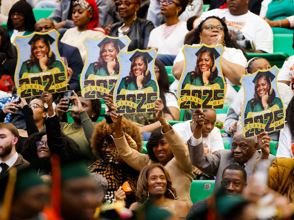 A FAMU family displays DIY signage for their loved one.