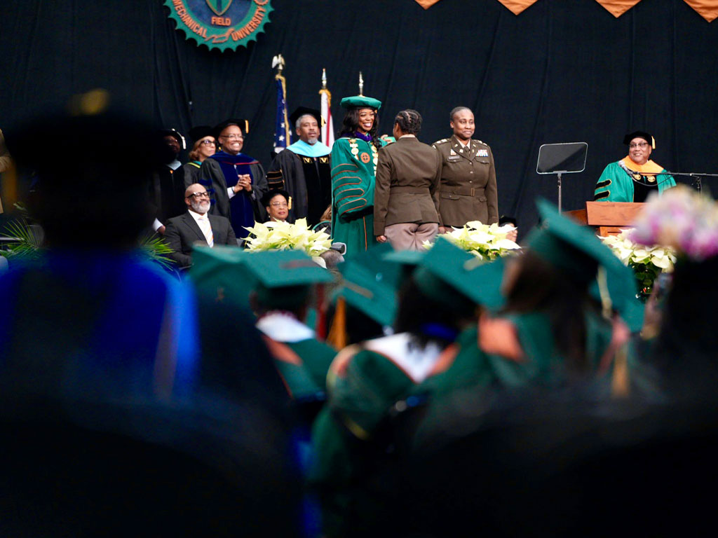 President Johnson commissioned military cadets.