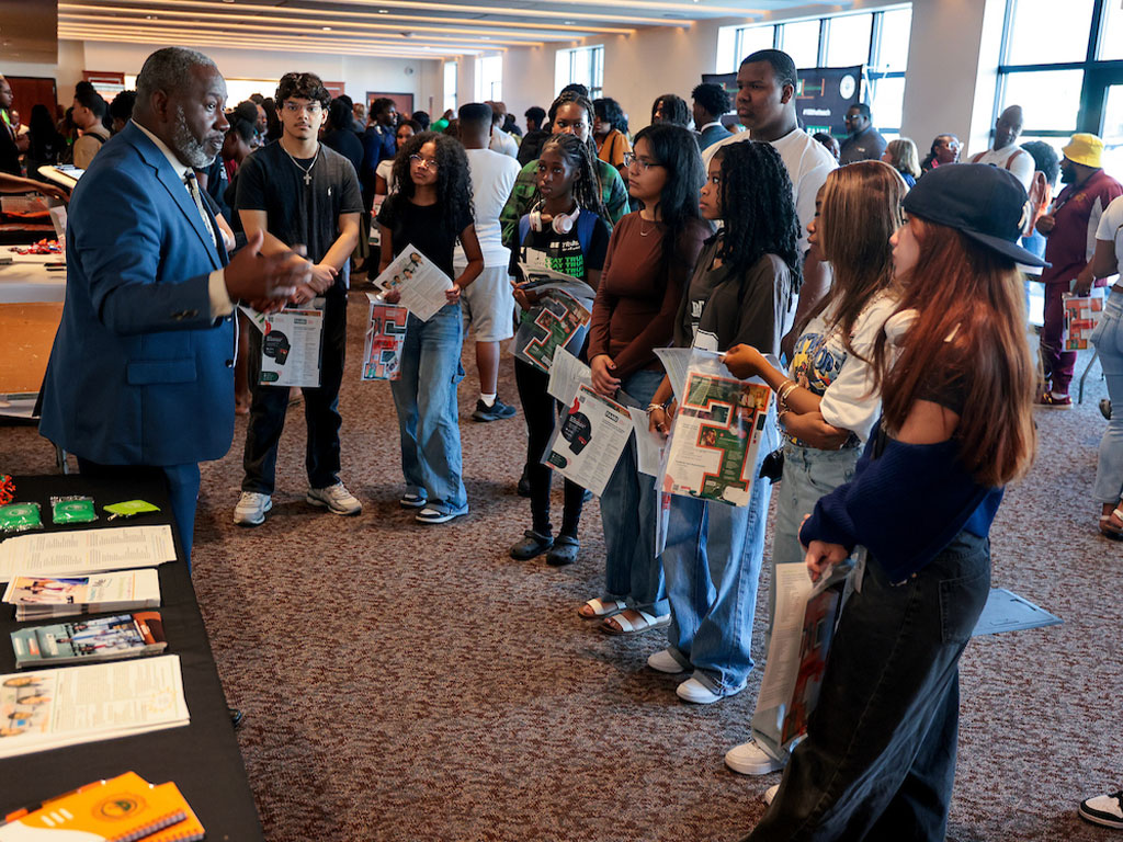 High school students listening intently to what the School of Pharmacy offers at FAMU.