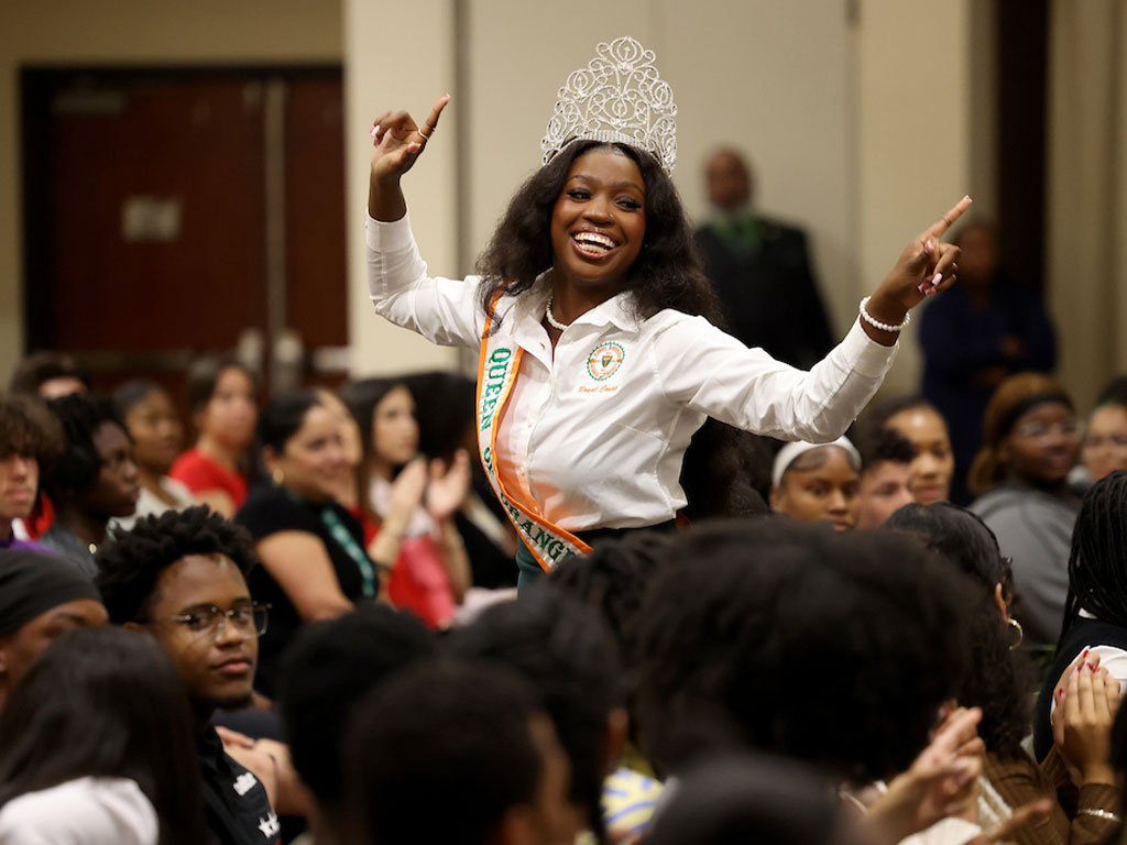 Queen of Orange and Green Tamia Williams leads the students in one of several FAMU chants.