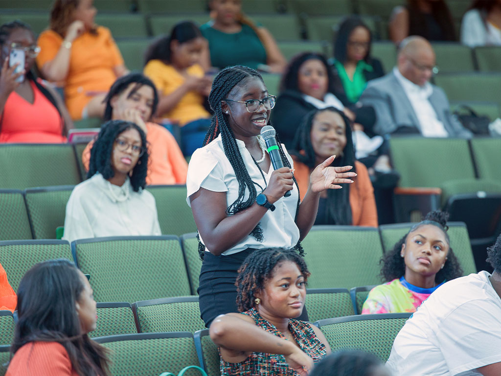 A FAMU student poses a question to the panel during a "Grads Are Back" session.