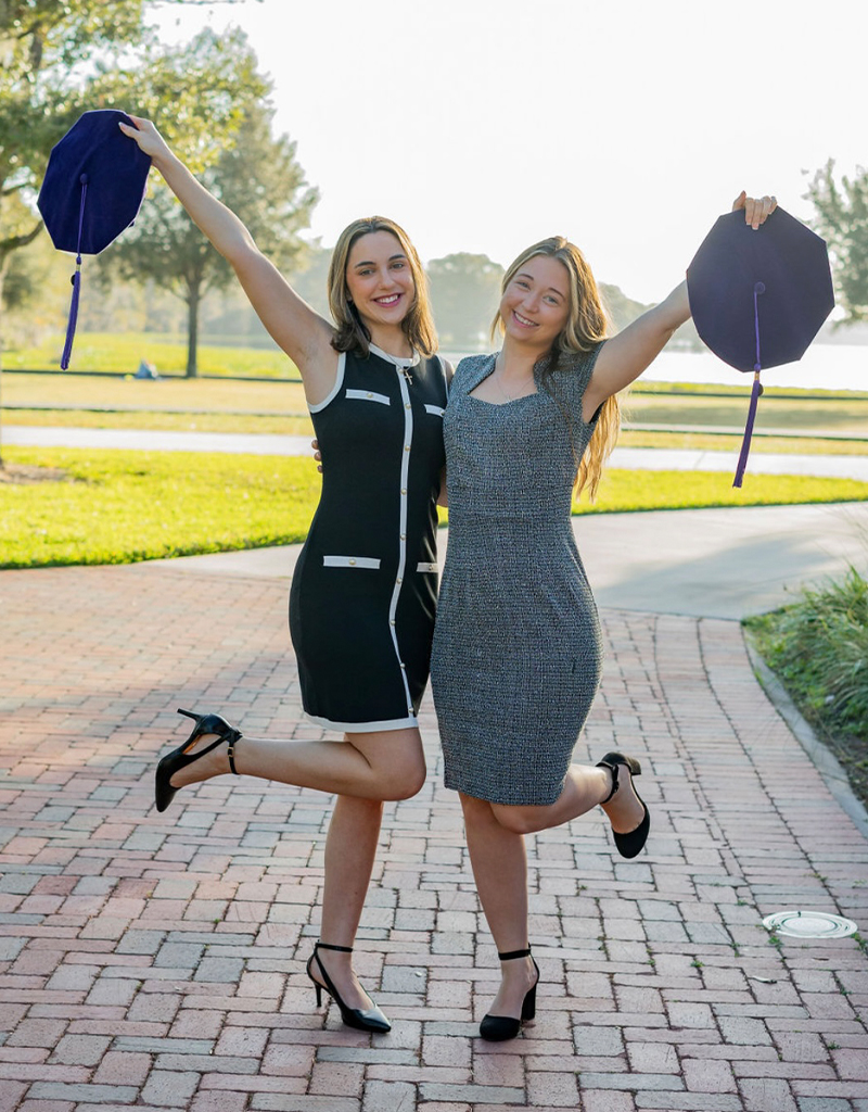 (Left to Right) Christina Lanzilla and Stephanie Maines pose for graduation photos in celebration of completing FAMU College of Law.