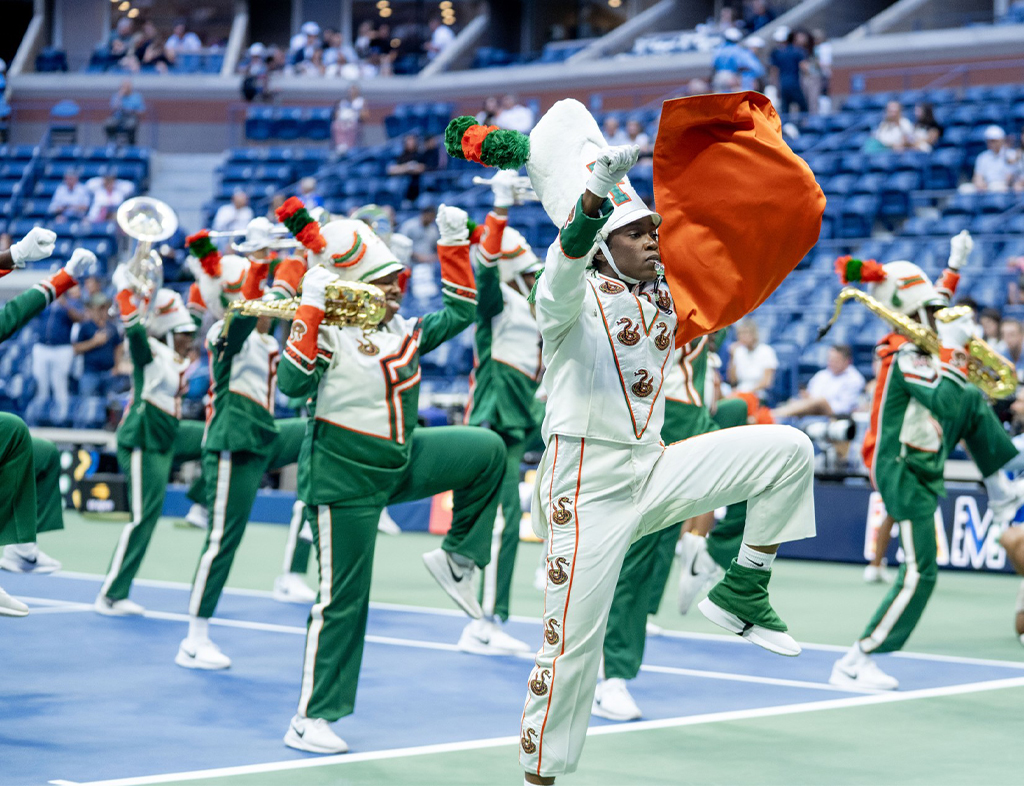 The Florida A&M University Marching “100” performs at the 2025 U.S. Open to celebrate the remarkable accomplishments of alumna and tennis icon Althea Gibson, who broke the color barrier in professional tennis. Gibson, who attended FAMU on a tennis scholarship, won five Grand Slam singles titles, including consecutive U.S. Open and Wimbledon championships in 1957 and 1958. (Photo by Vaughn Wilson/Florida A&M University).