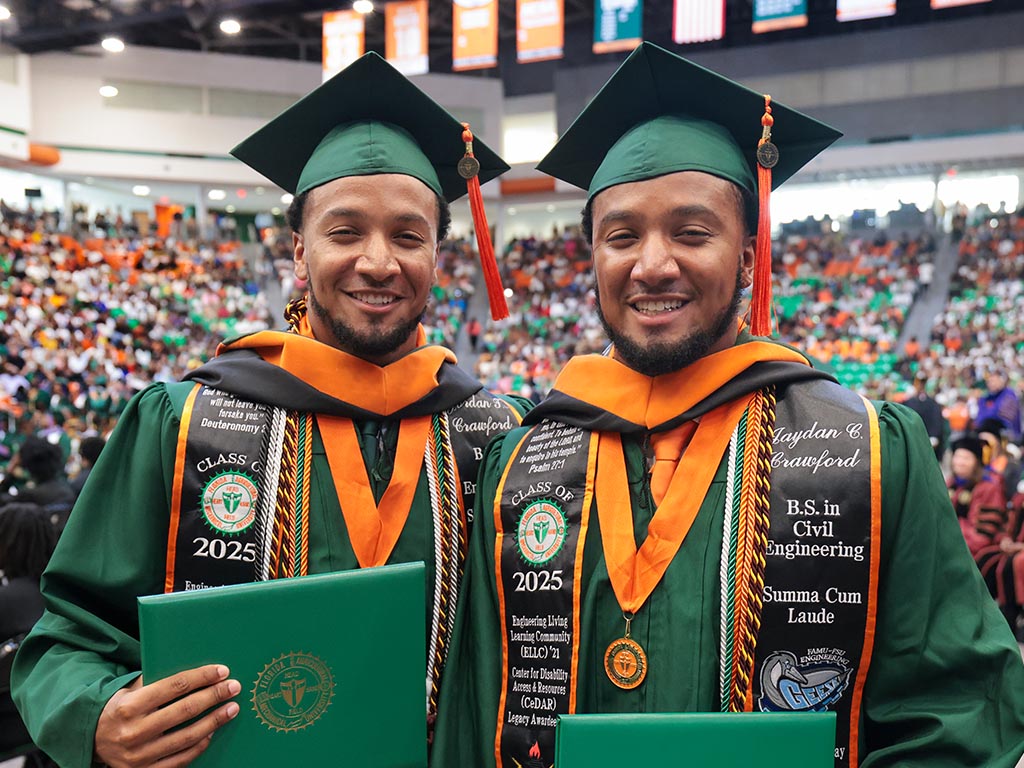 Twin brothers Jordan and Jaydan Crawford pose for picture during commencement